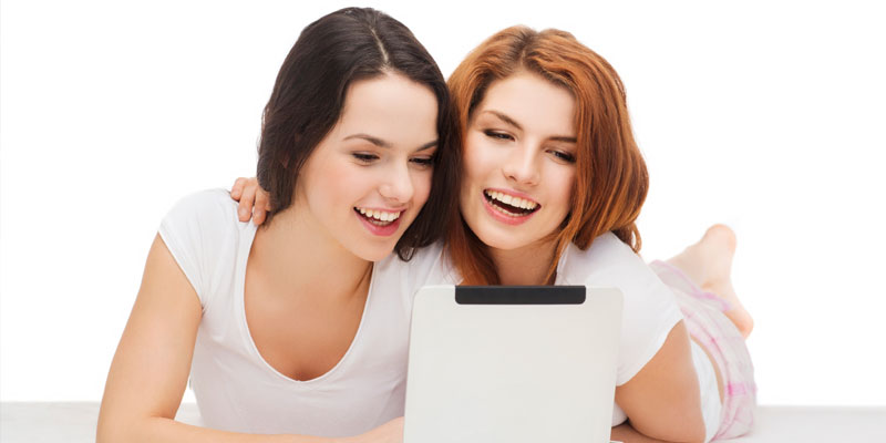 women-laughing-tablets